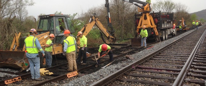 TRAM track crew replaces railroad ties